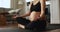 Pregnant woman sit cross-legged perform yoga makes breathing exercises