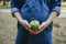 Pregnant woman snacking healthy with green apple