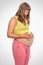 Pregnant woman with stomach ache - heartburn concept