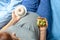 Pregnant woman with a stomach and holding donut and yellow measuring tape. Diet for pregnant women.