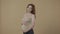 A pregnant woman strokes her bloated stomach with love and tenderness. Profile portrait of a pregnant woman in the