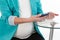 Pregnant woman taking a blood sample from her finger for glucose level