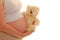 Pregnant woman with a teddy bear