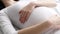 Pregnant Woman Touching Baby Belly Closeup