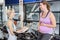 Pregnant woman and trainer talking