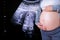 Pregnant Woman with ultrasound equipment background