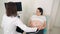 Pregnant woman undergoing ultrasound test at clinic