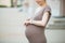 Pregnant woman using smart watch. Close-up