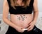 Pregnant woman verifing glycemic index with device for gestational diabetes in pregnancy