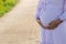 A pregnant woman is waiting for an ambulance to be taken to the hospital. A mother with abdominal pain from an imminent pregnancy