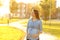 Pregnant woman walking looking at side in a park