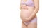 Pregnant woman wearing purple underwear touching her belly