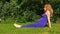 Pregnant woman yoga exercise during pregnancy outdoor at garden