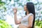 Pregnant women drink cold water after exercising in park in fresh air