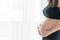 Pregnant women, motherhood, people and expectation concept. Closed up of happy pregnant beautiful woman with big belly standing