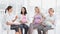 Pregnant women talking together at antenatal class