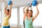 Pregnant women training with exercise balls in gym