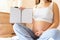 Pregnant writing baby list. Beautiful pregnancy woman writing check list. Happy pregnant lady holding notepad. Pregnancy