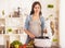 Pregnant Young Woman Cooking with Food Processor.