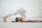 Pregnant young woman doing prenatal yoga. Plow pose