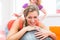 Pregnant young women getting backrub with spiky massage ball