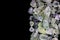 Prehnite heap jewel stones texture on half black background