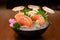 Premium Japanese Salmon Sashimi, Chutoro, on ice in bowl.