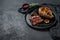 Premium marble beef black Angus. Fried fillet. Organic farm meat. Black background. Space for text