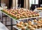 Premium sliders succulent beef, melted cheese, pickles and special sauce on soft buns at an upscale buffet