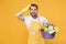Preoccupied man househusband in apron rubber gloves hold basin with detergent bottles washing cleansers doing housework