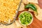 Preparation of bean dip with jalapenos, sour cream and cheddar c