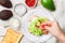 Preparation of bread toast with avocado, cottage cheese ricotta, coarse sea salt and pink pepper