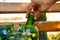 Preparation for canning cucumbers for the winter, woman arranges ingredients in a jar close-up