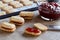 Preparation of Christmas cookies - filling the cookies with jam