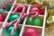 Preparation for Christmas: festive balls and candy cane in wooden box, light white frame