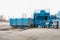 Preparation of a container with waste for subsequent transportation to a waste disposal plant. Waste processing plant