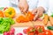 Preparation of cutting vegetables for salad, close up hands