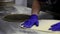 preparation of dough for pizza. Cooking pizza in a restaurant. hands of chef with gloves on