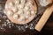 Preparation dumplings on wooden board.