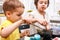 Preparation for Easter. Boys paints easter eggs