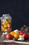 Preparation of fermented vegetables. Fresh tomatoes,cauliflower,spices in the foreground. Dark background. Copy space