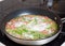 Preparation of frittata with smoked trout and asparagus