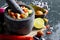 Preparation of guacamole in a traditional stone mortar with all its ingredients chopped avocados, lime, onion, tomatoes and chili