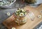 Preparation of herbal syrup from common daisy flowers on a table