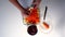 Preparation of herring under a fur coat. The man grinds on a grater the boiled carrots on top of a layer of a potato.