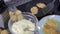 Preparation of homemade vegetable pancakes of grated potato on frying pan