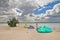 Preparation for kitesurfing on the estuary under a picturesque sky