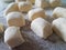 Preparation of lazy dumplings from cottage cheese. Dough cubes.