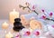 Preparation for massage with two towels, stones, candles and orchid