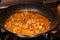 Preparation in a pan on the stove home cooking